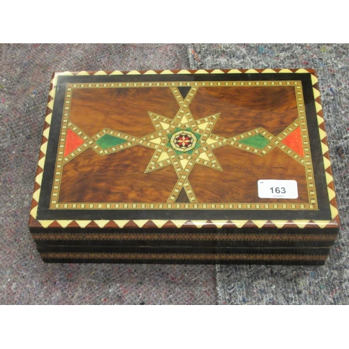 163 - A painted wooden chess set, contained in a marquetry, lacquered, folding box, incorporating a board ... 