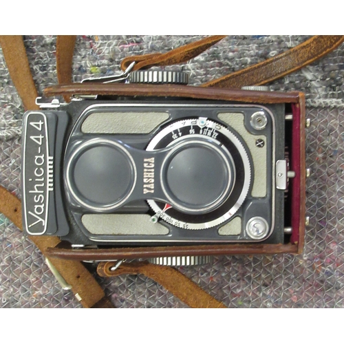 164 - A Yashica -44 camera; and a Weston Master V light meter 