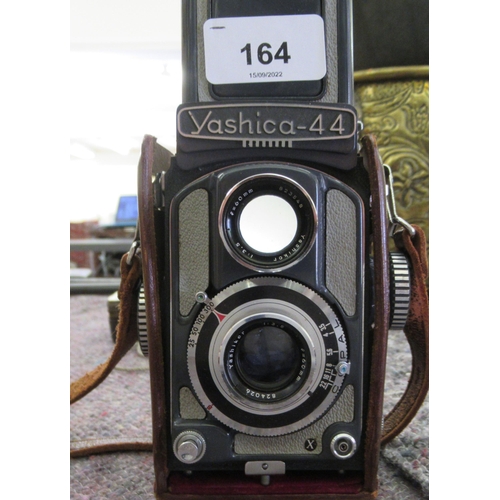 164 - A Yashica -44 camera; and a Weston Master V light meter 