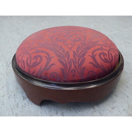 169 - An Edwardian tub style boudoir chair, upholstered in floral patterned maroon fabric with a fringed v... 