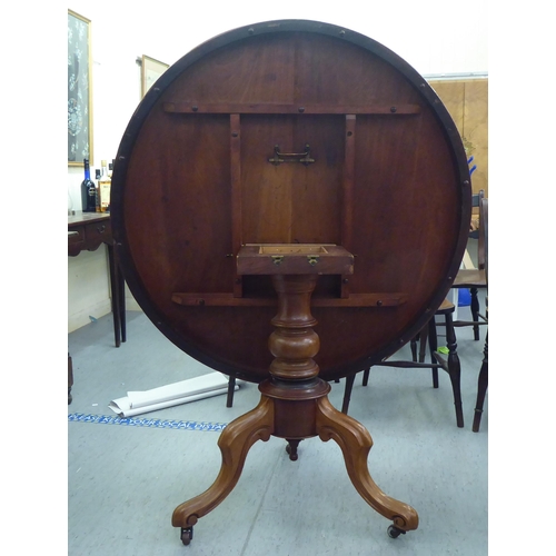 170 - Two similar late Victorian mahogany tip-top breakfast table, over pedestal supports, raised on platf... 