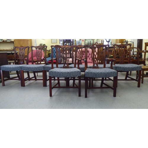 176 - A set of eight Chippendale design mahogany framed dining chairs, each with a splat back, raised on s... 