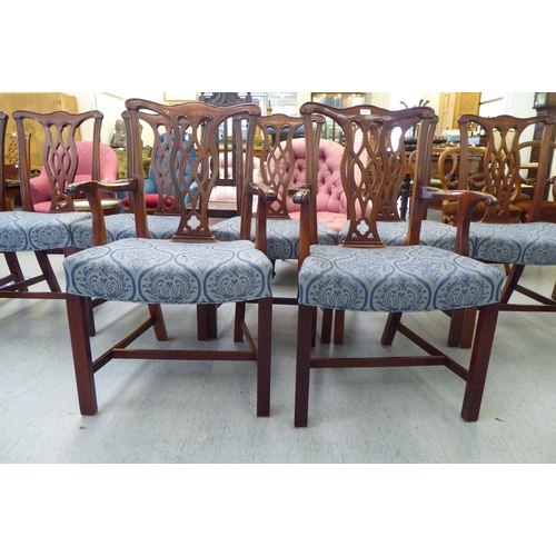 176 - A set of eight Chippendale design mahogany framed dining chairs, each with a splat back, raised on s... 