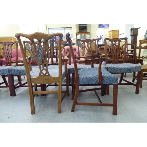 176 - A set of eight Chippendale design mahogany framed dining chairs, each with a splat back, raised on s... 