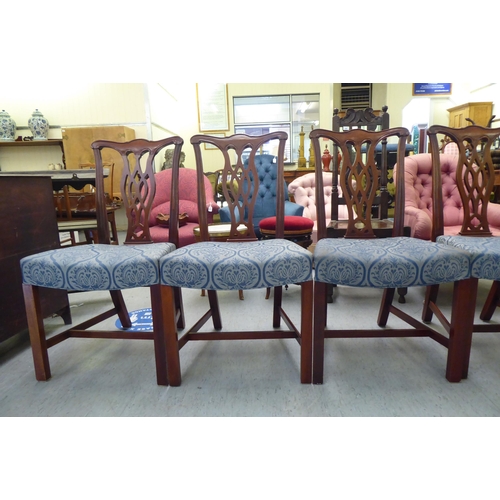 176 - A set of eight Chippendale design mahogany framed dining chairs, each with a splat back, raised on s... 