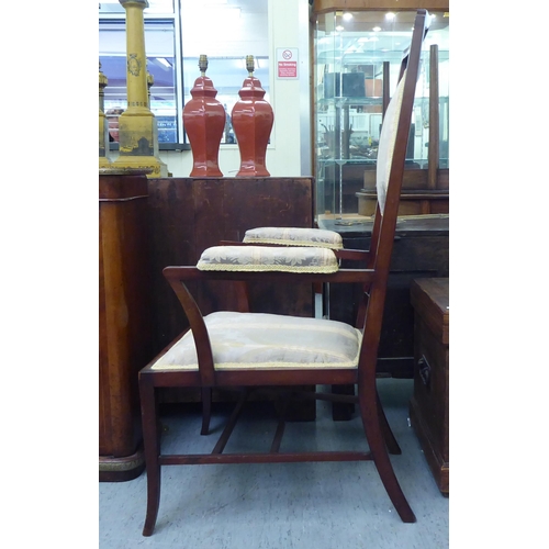 189 - An early 20thC mahogany framed side chair with a high back and open arms, upholstered in braided flo... 