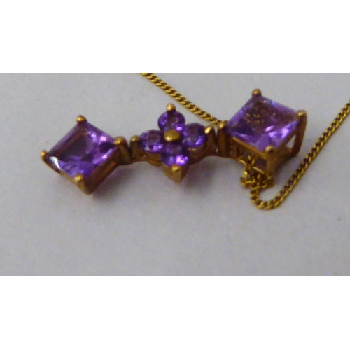 192 - A 9ct gold pendant, set with amethysts, on a fine 9ct gold neckchain 