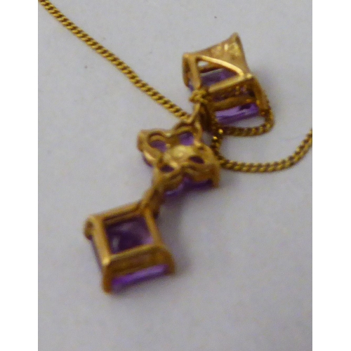 192 - A 9ct gold pendant, set with amethysts, on a fine 9ct gold neckchain 