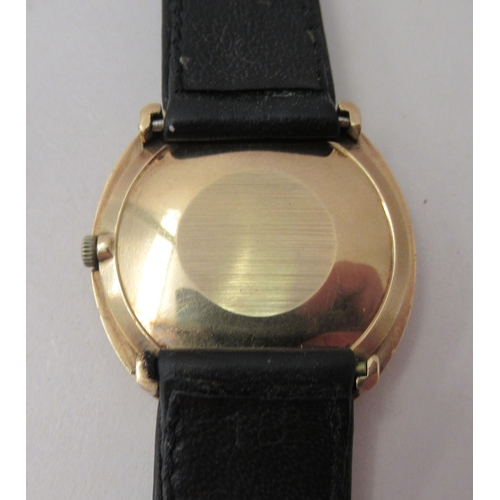 193 - A 9ct gold cased Omega De Ville wristwatch, faced by a baton dial, on a black hide strap