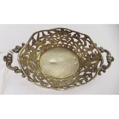 224 - An early 20thC Berthold Muller Continental silver oval sweet basket with pierced ornament  bears imp... 