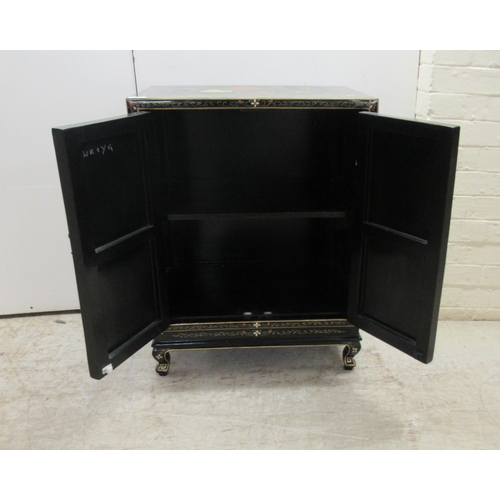 242 - A 20thC Japanese black lacquered and gilded side cabinet with a pair of panelled doors, raised on br... 