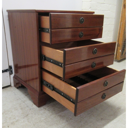 249 - A modern mahogany three drawer chest, fashioned as six facsimiles with provision to hold CD's, raise... 