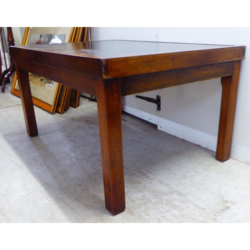 250 - A 20thC mahogany framed coffee table, the top set with a tooled and gilded hide scriber, raised on s... 