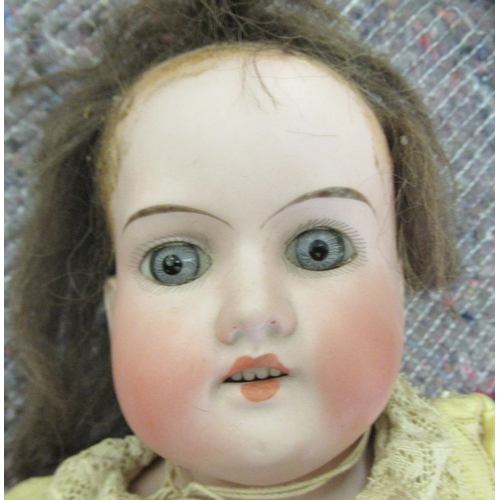 268 - An early 20thC Armand Marseille bisque head doll with painted features and fixed eyes and mobile lim... 