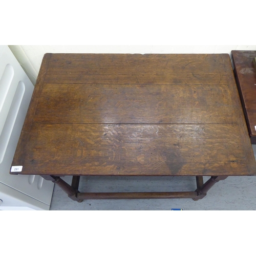 291 - An early 19thC oak side table, raised on turned and block supports, united by stretchers  28