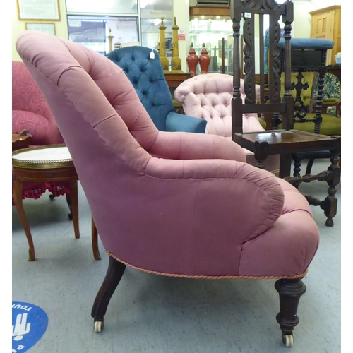 293 - A late Victorian salon chair, later upholstered in pink fabric, raised on turned, tapered forelegs a... 