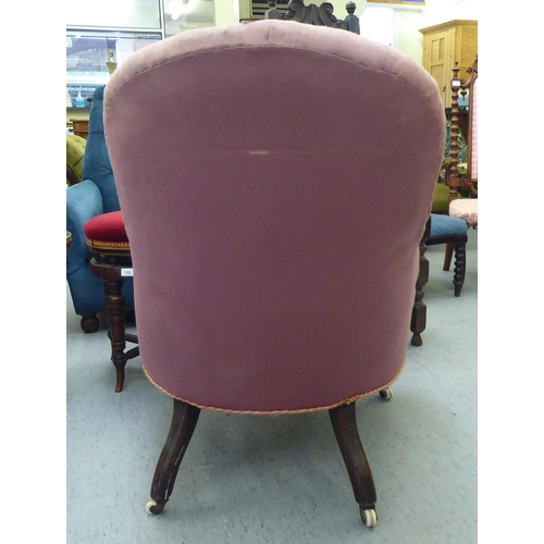 293 - A late Victorian salon chair, later upholstered in pink fabric, raised on turned, tapered forelegs a... 