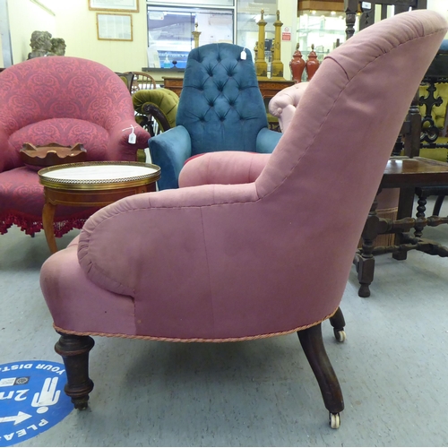 293 - A late Victorian salon chair, later upholstered in pink fabric, raised on turned, tapered forelegs a... 