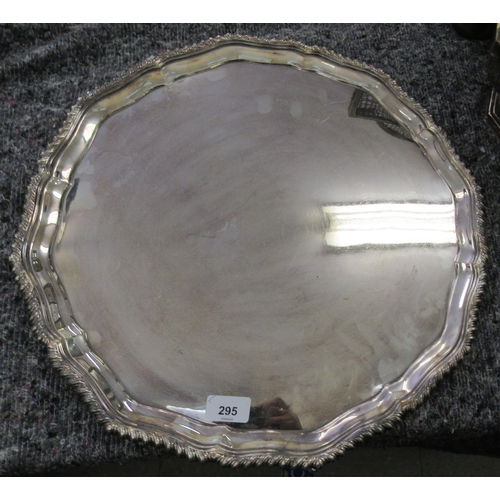 295 - A Georgian design silver plated salver with a wavy thumb moulded border, raised on splayed feet ... 