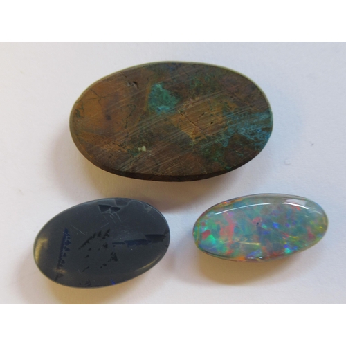 31 - Three dissimilar, unmounted opals