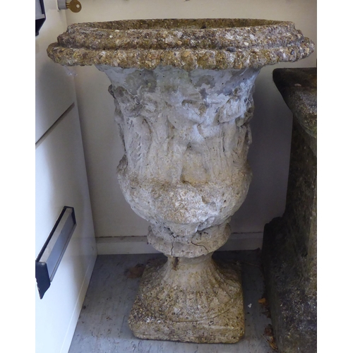 50 - A pair of composition stone terrace pedestal vases, each moulded with a frieze of figures  21