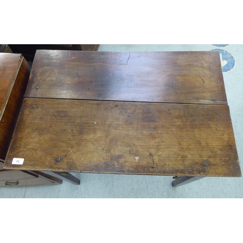 52 - A late 18th/early 19thC oak side table, the plank top over a shallow, long drawer, raised on square,... 