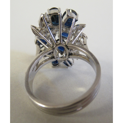 54 - A white gold dress ring, set with sapphires and diamonds  stamped 14k/585