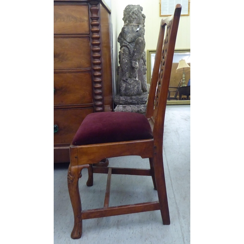 58 - An early 19thC yewwood framed side chair with a yoke rail, ribbon splat and an upholstered, drop-in ... 