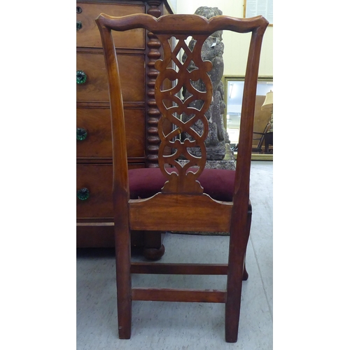 58 - An early 19thC yewwood framed side chair with a yoke rail, ribbon splat and an upholstered, drop-in ... 