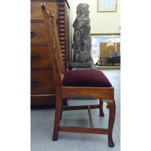 58 - An early 19thC yewwood framed side chair with a yoke rail, ribbon splat and an upholstered, drop-in ... 