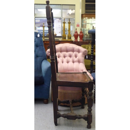 84 - A late 18thC fruitwood, beech and elm side chair, the high back with carved ornament between turned ... 