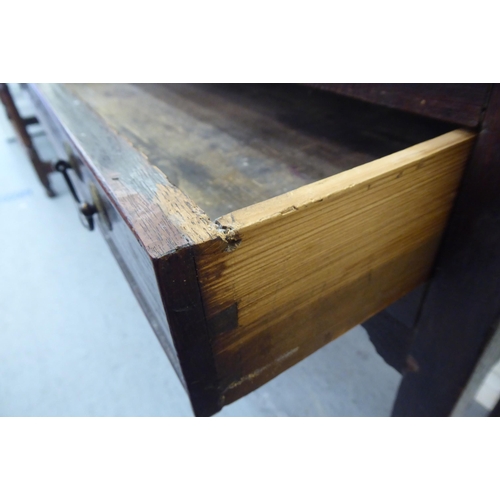 88 - A 19thC country made oak side table, the planked top over an apron drawer with cockbeading and brass... 