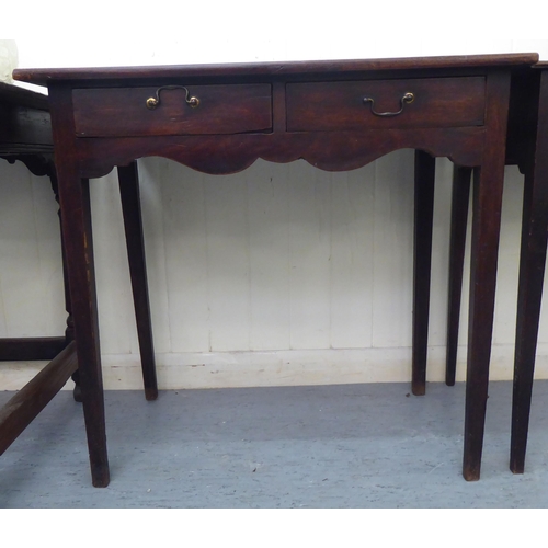 95 - A 19thC mahogany side table with a pair of inline frieze drawers, over a shaped apron, raised on squ... 