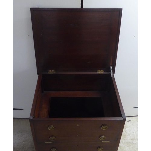 97 - A late Georgian mahogany night commode, in the style of a dressing chest with lacquered brass flank ... 