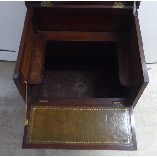 97 - A late Georgian mahogany night commode, in the style of a dressing chest with lacquered brass flank ... 