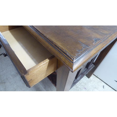 98 - A 1920s mahogany office work table, the pair of shallow, linen drawers with brass bail handles, rais... 