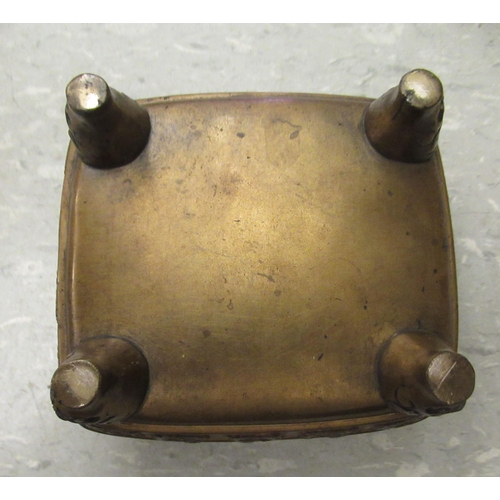 194 - An early 20thC Chinese bronze censer, cast with animal and cloud motifs, on mask feet  3.5