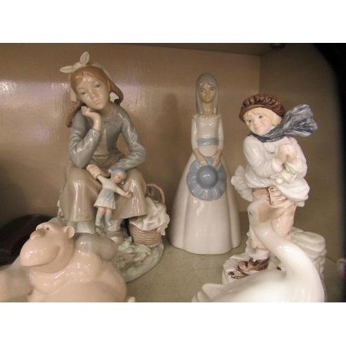 68 - Ceramic figures: to include examples by Lladro and Worcester  largest 8