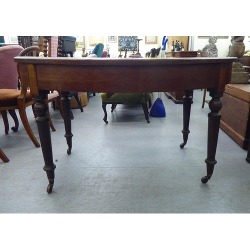 118 - A late 19thC Continental cherrywood oval dining table with a hardwood parquet finished top, over a d... 