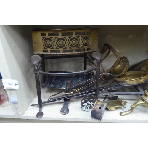 294 - Mainly 19thC functional metalware: to include cast iron and a brass skillet 