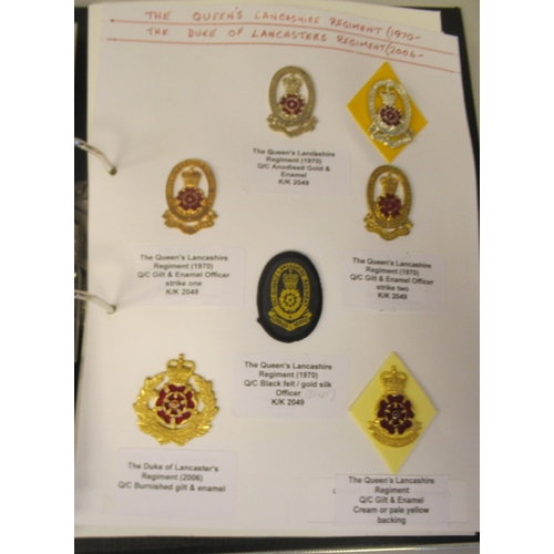 108 - An album collection of fully identified British military badges, some copies, comprising Manchester ... 