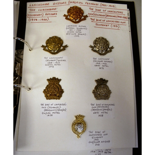 108 - An album collection of fully identified British military badges, some copies, comprising Manchester ... 