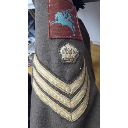 155 - A British battledress top with maroon arm badges, wing and reverse collar ribbon(Please Note: this l... 