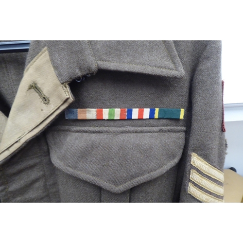 155 - A British battledress top with maroon arm badges, wing and reverse collar ribbon(Please Note: this l... 