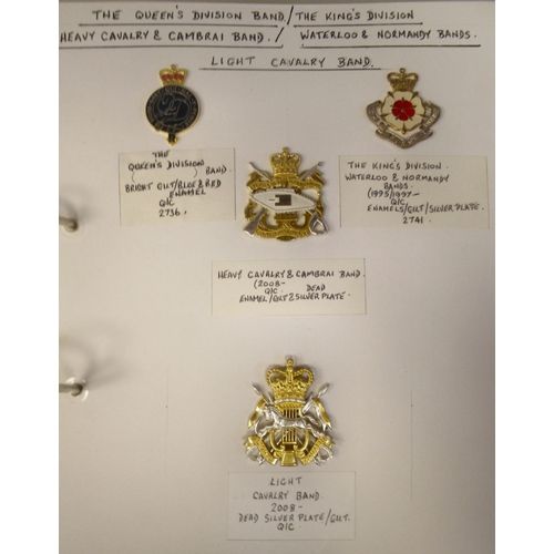 161 - An album collection of fully identified British military badges, some copies, comprising bands and m... 