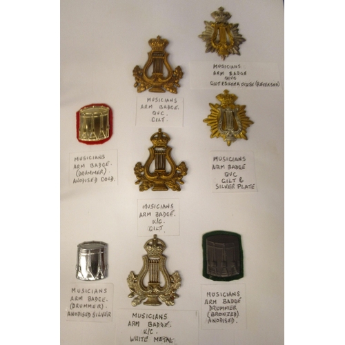 161 - An album collection of fully identified British military badges, some copies, comprising bands and m... 