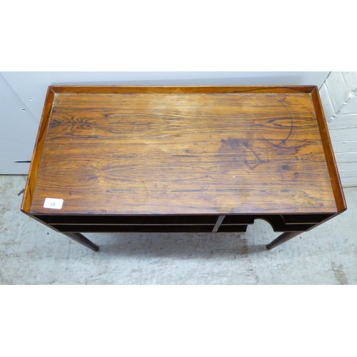 28 - A 1960s Danish rosewood side table with a low galleried top, over two enclosed shallow shelves, rais... 