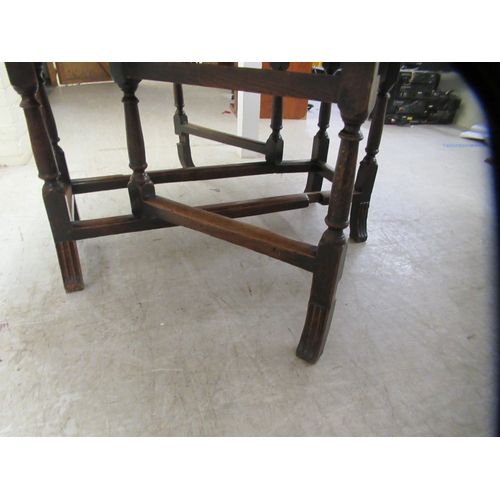 33 - An 18th/19thC oak gateleg table, the oval planked and dowelled top over an end drawer, raised on a r... 