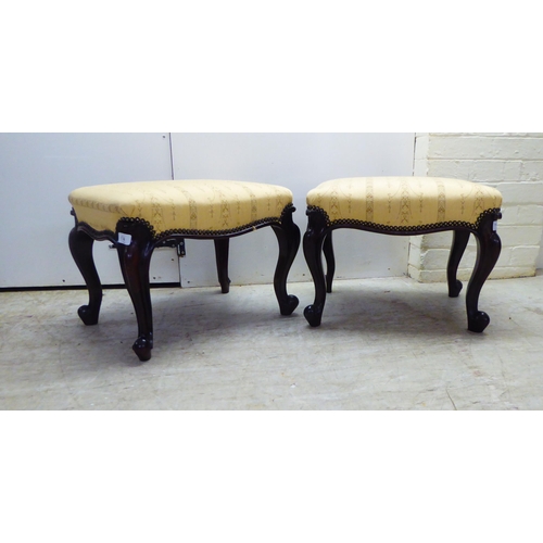 4 - A pair of mid 19thC rosewood framed stools with stud upholstered, old gold coloured fabric tops, rai... 