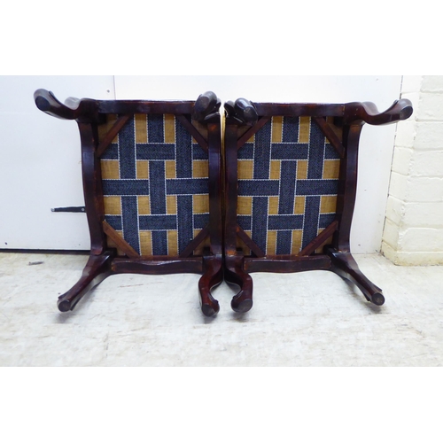 4 - A pair of mid 19thC rosewood framed stools with stud upholstered, old gold coloured fabric tops, rai... 